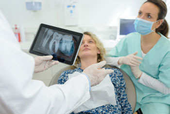 patient being shown digital x-ray