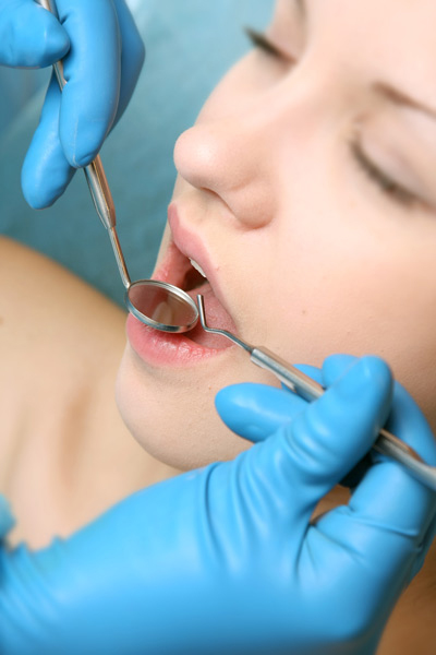 woman at dentist for root canal therapy