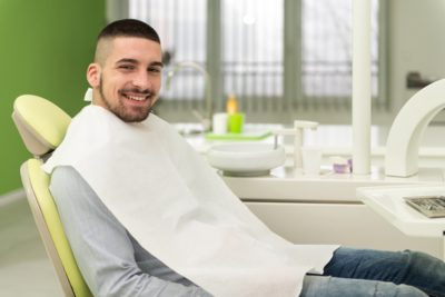 man smiling after treatment of gum disease