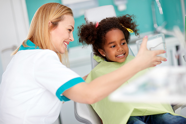 child with dentist getting a dental checkup