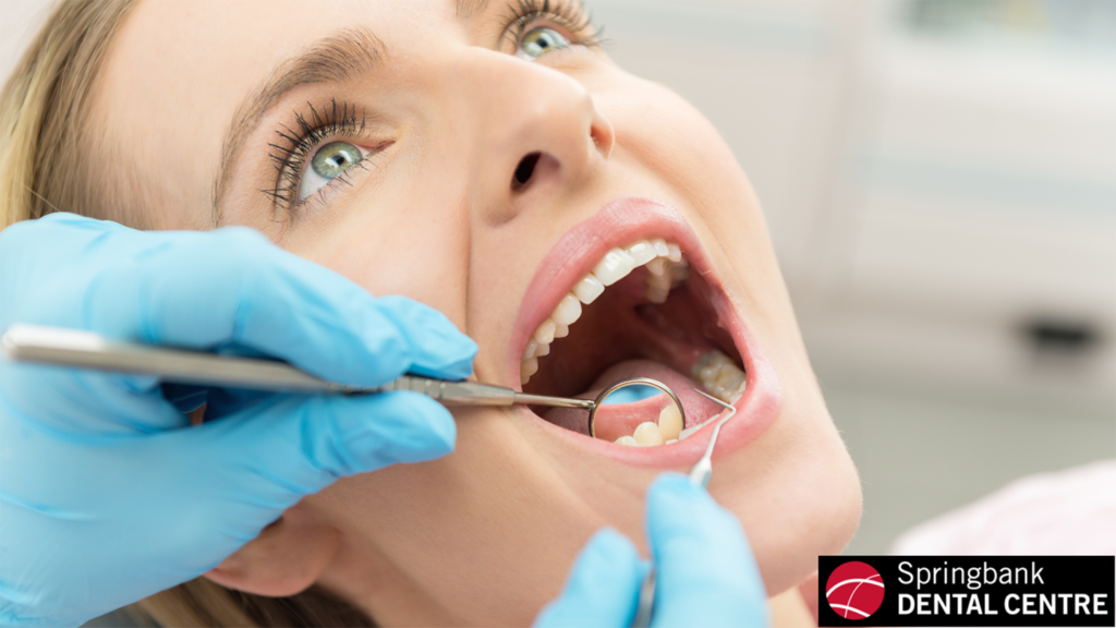 A woman receiving a dental exam.